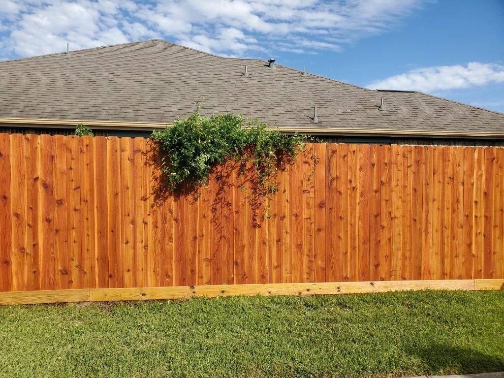 Professionally stained wood fence
